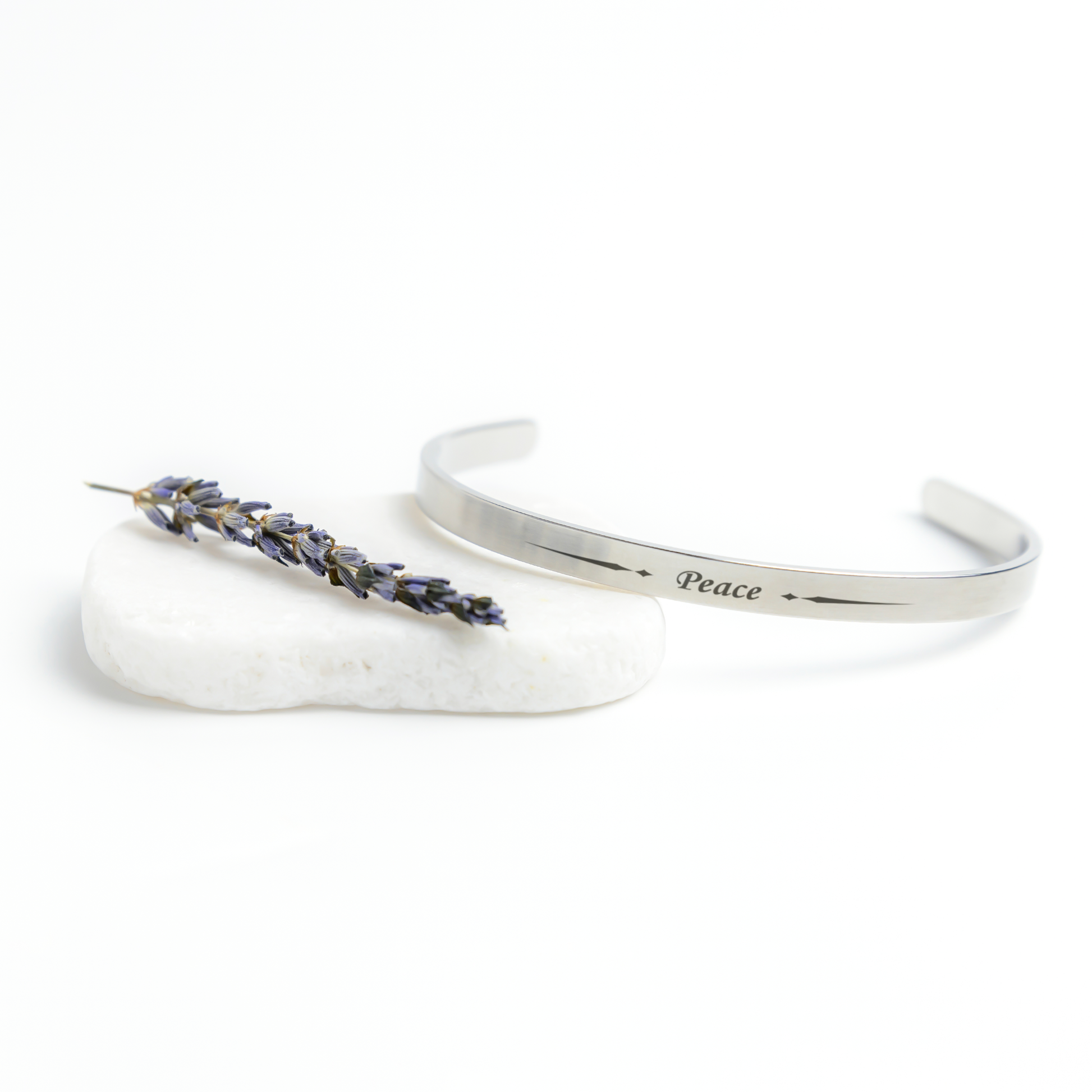 New_Beginnings_2025_-_Peace_Cuff_Bracele_Silver_Lifestyle_03_Mockup.png